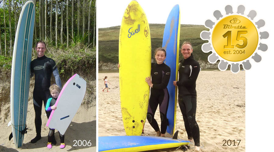 Paul Brown, Founder of Bibetta, with his daughter whilst toddler and teenage in wetsuits with surfboards