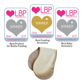 bibetta burp cloth in cream and beige folded in half on a white background with three awards from LBP in 2017. Silver for Best Product for Bottle Feeding, Gold for Best Feeding Accessory, Silver for Best Baby Accessory