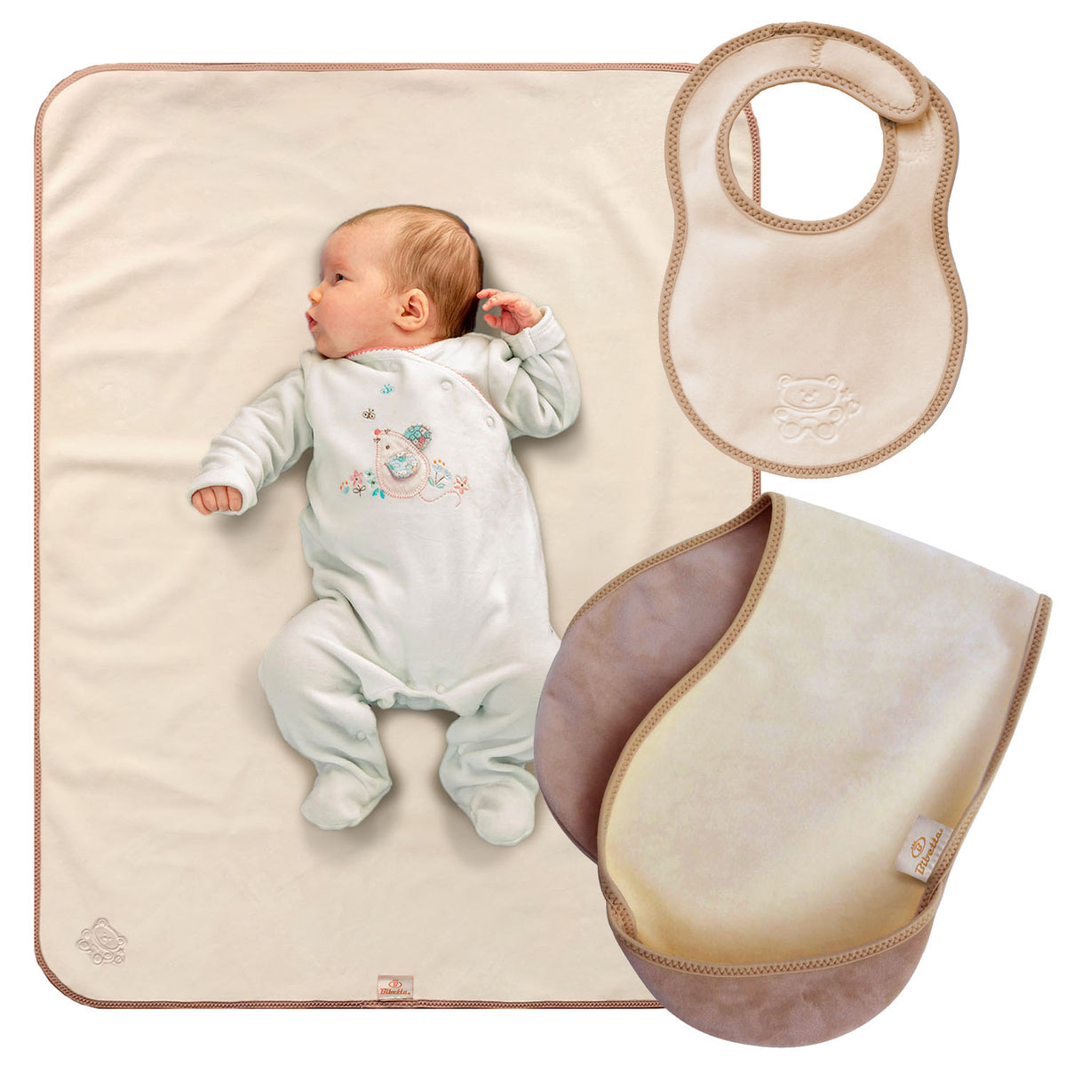 bibetta newborn plush cream and beige baby bib, burp cloth and tummy time mat with a beige bias binding with a zig-zag stitch and a teddy embossed in the front on a white background. The burp loth in folded in half and has the pockets folded to the the front.