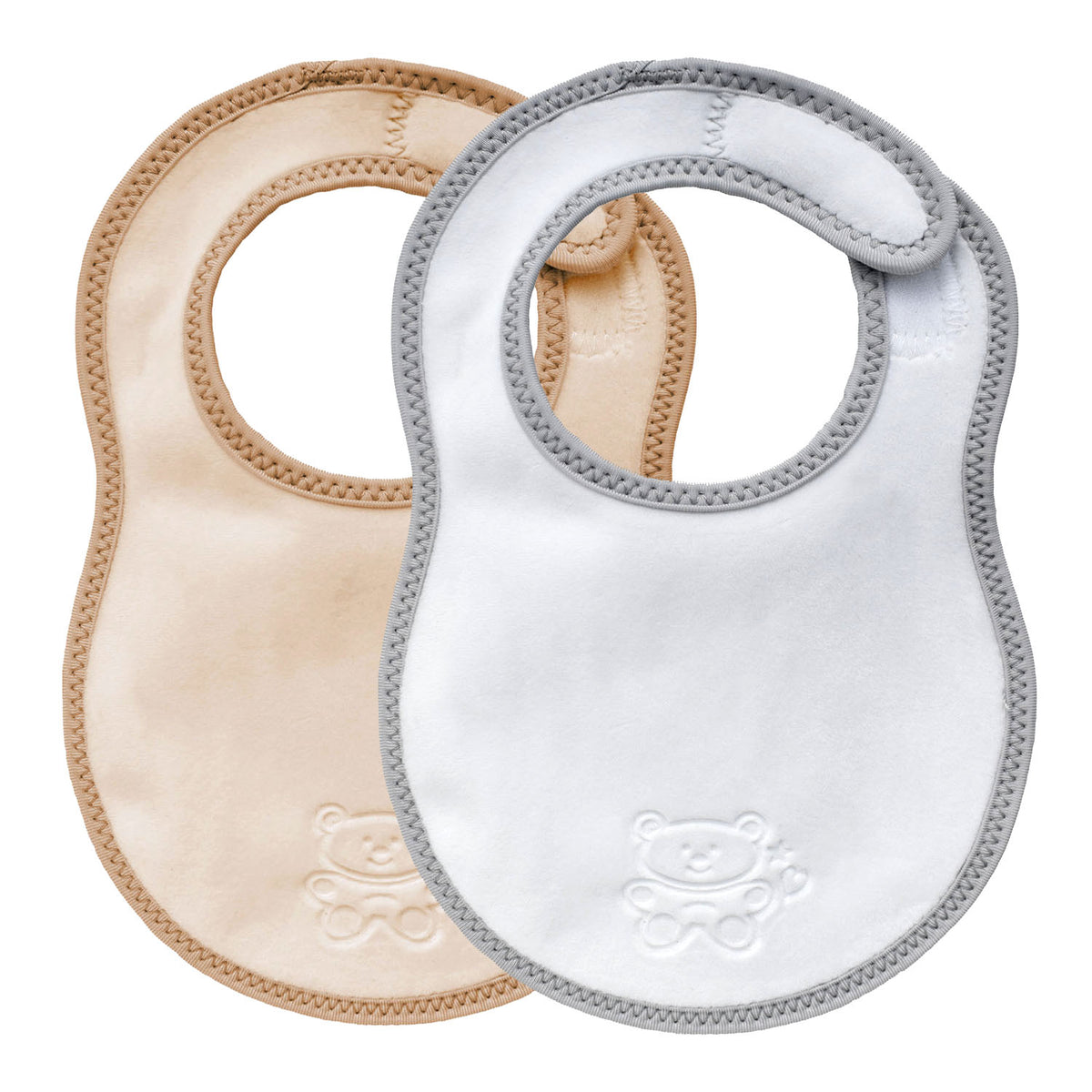 Two bibetta newborn plush bibs, one cream and beige with beige  bias binding and one white and grey baby bib with a grey bias binding with a zig-zag stitch and a teddy embossed in the front on a white background