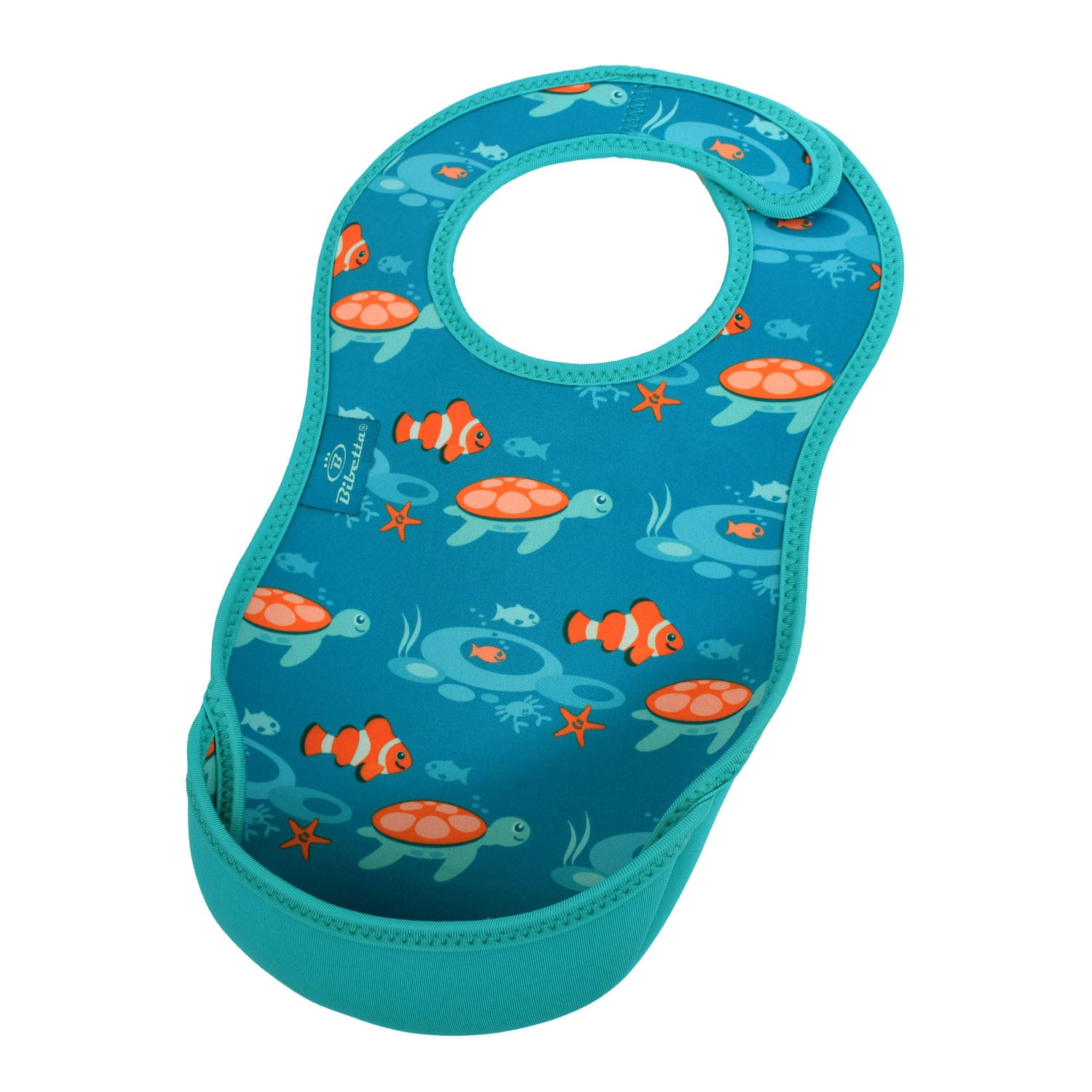 Bibetta blue baby bib with tropical fish pattern, made of neoprene material, featuring orange fish, turtles and a sea scene with the pocket flipped out to the front