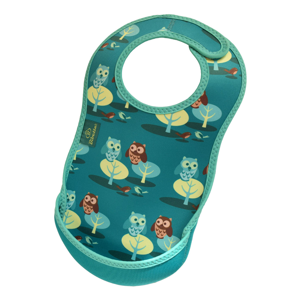 Bibetta green baby bib with owl pattern, made of neoprene material, featuring trees and owls in a forest design with the pocket flipped out to the front