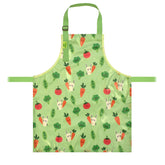 a bibetta wipeezee childs apron in green bunny and veg pattern laid flat . It has green neck strap and waist straps.