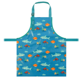 a bibetta wipeezee childs apron in turquoise sea creatures pattern laid flat . It has blue neck strap and waist straps.