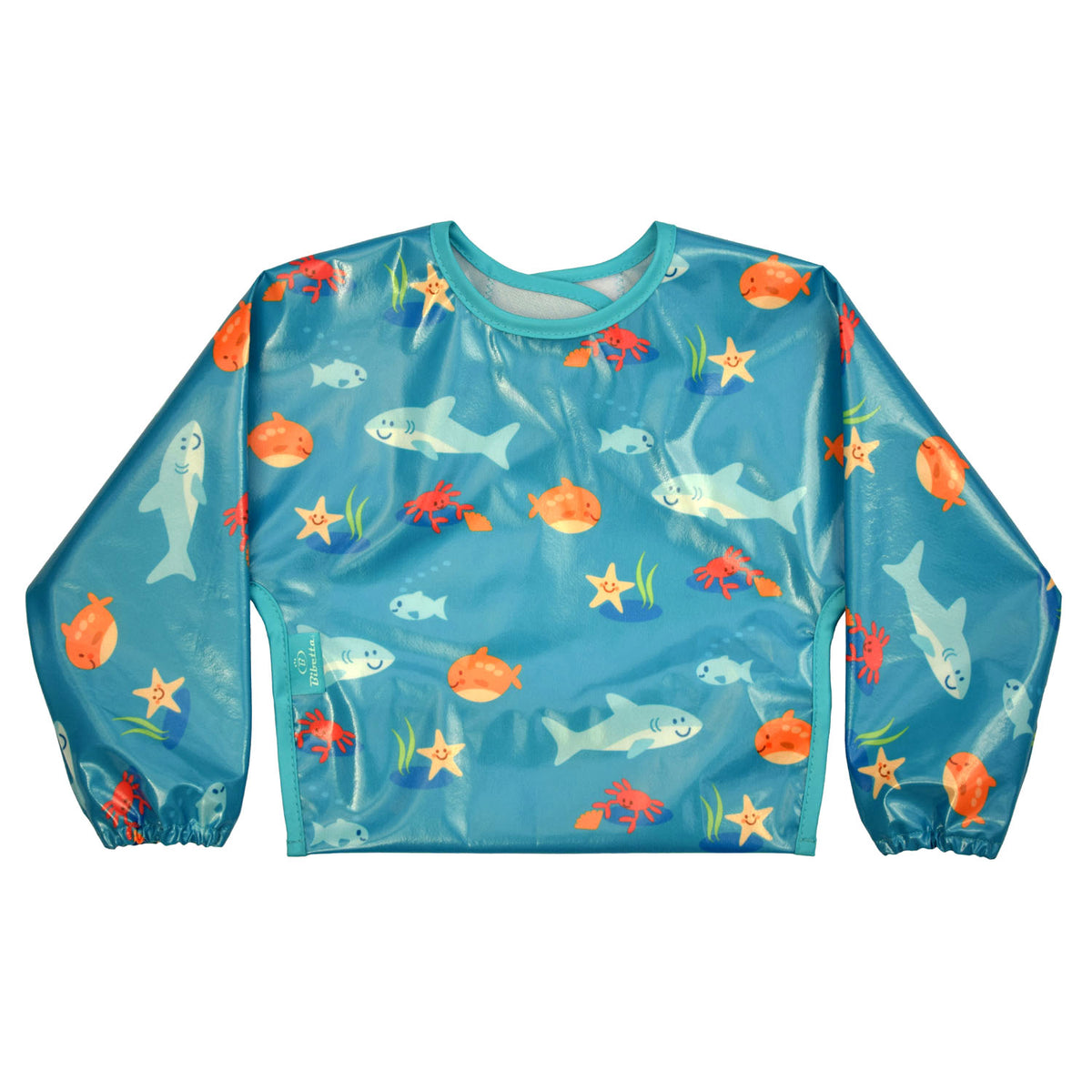 Bibetta wipeezee sleeved bib in turquoise sea creatures pattern laid flat with the sleeves folded over and the pocket to the back.