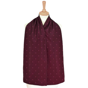 Burgundy straight scarf clothing protector with a subtle pattern on a mannequin against a white background