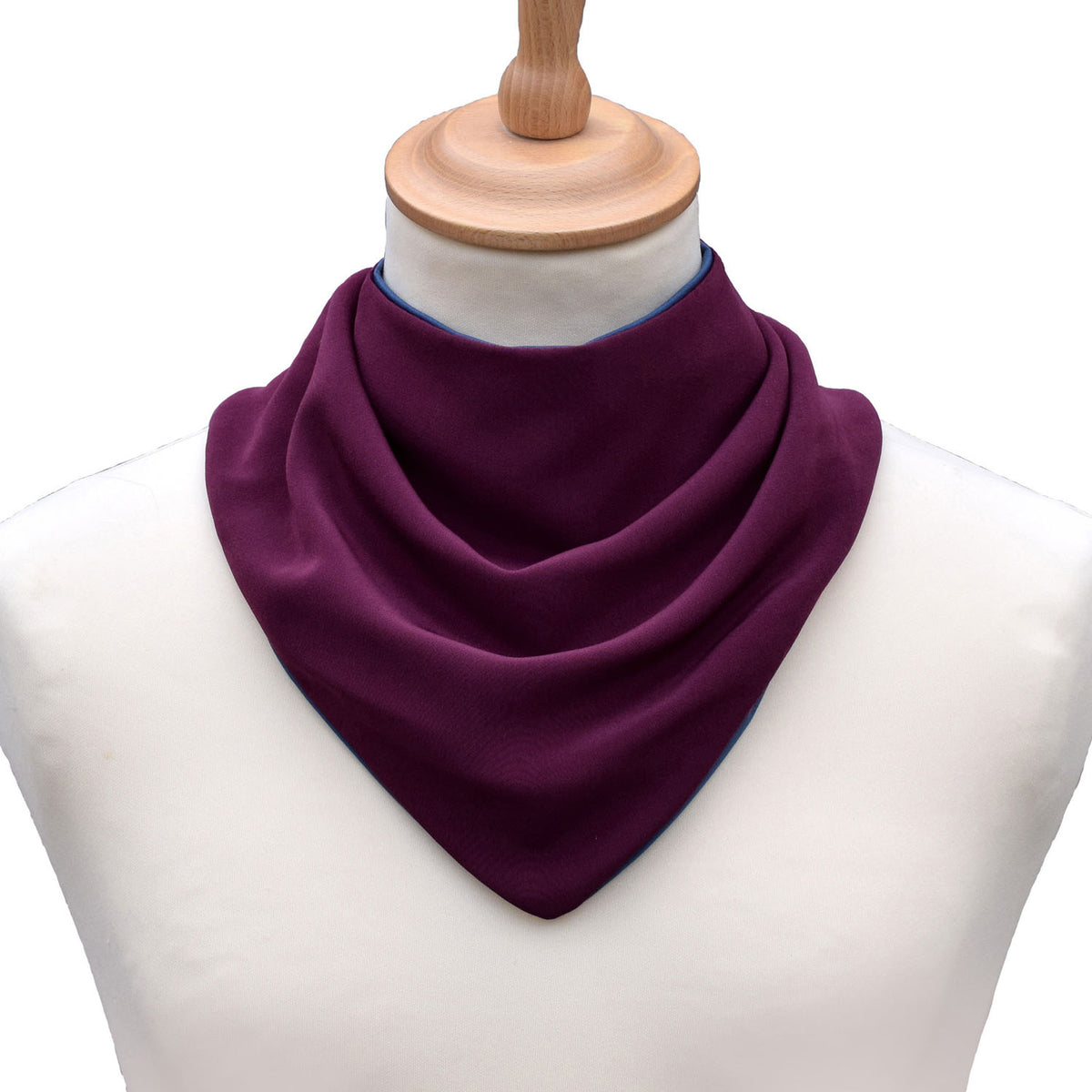 Aubergine neckerchief bib on a mannequin with a white background