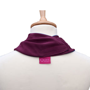Bank view of an aubergine neckerchief on a mannequin with 'care designs' label