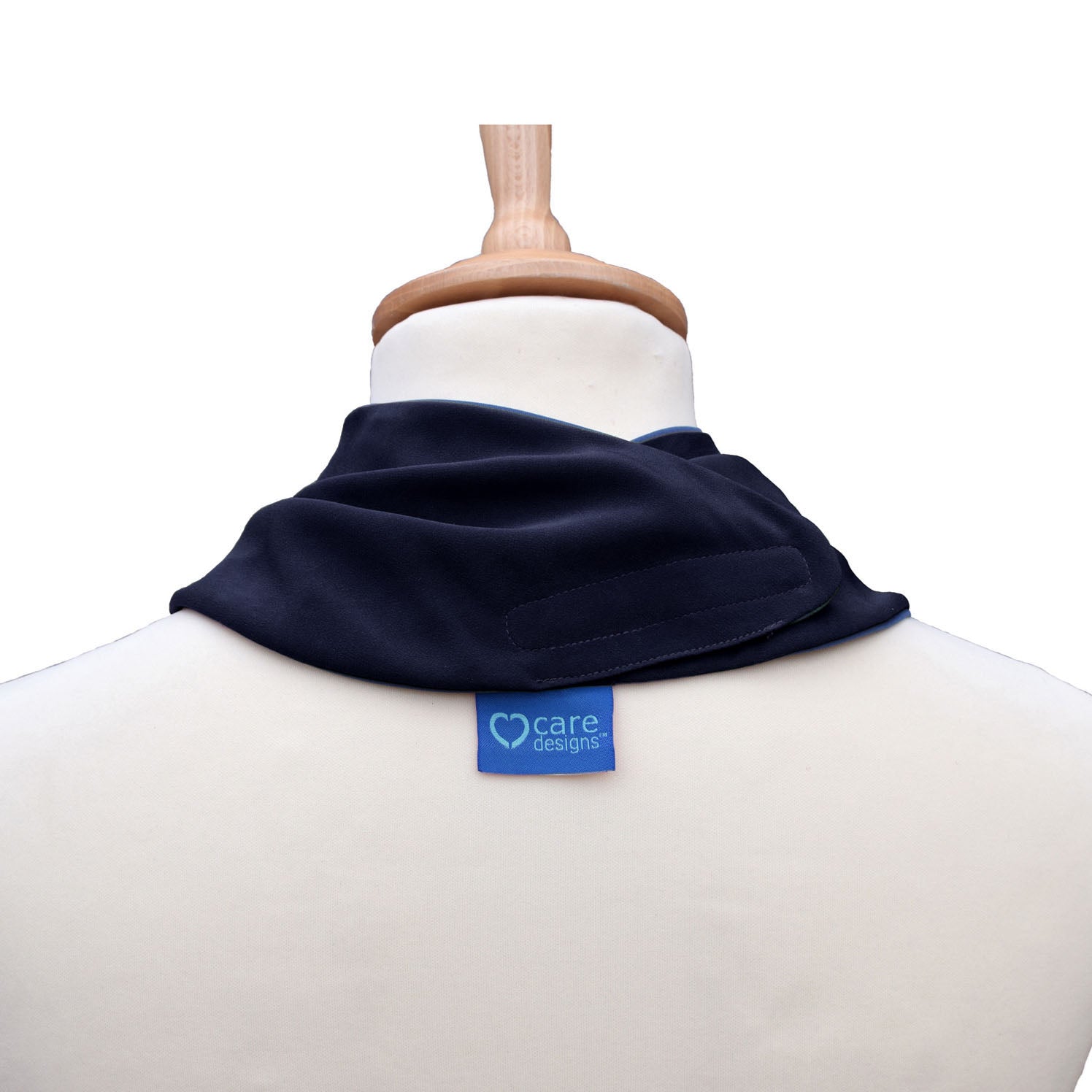 Back view of a black neckerchief bib on a mannequin with 'care designs' label.