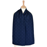 Navy blue straight scarf clothing protector with a subtle pattern on a mannequin against a white background